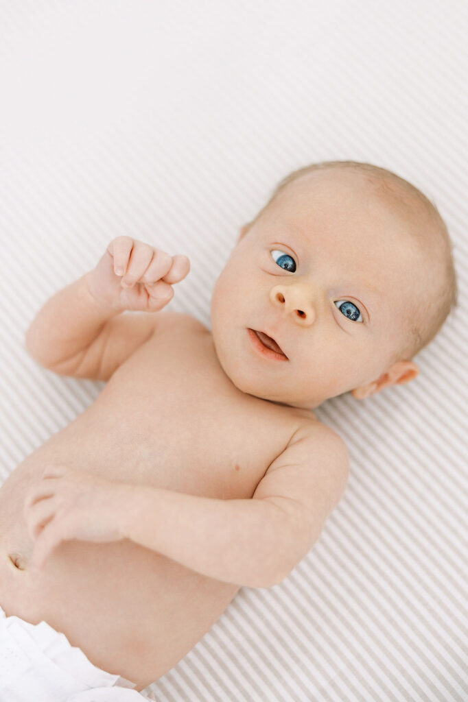 Alert newborn looking toward the camera during a Santa Clarita newborn photography session.