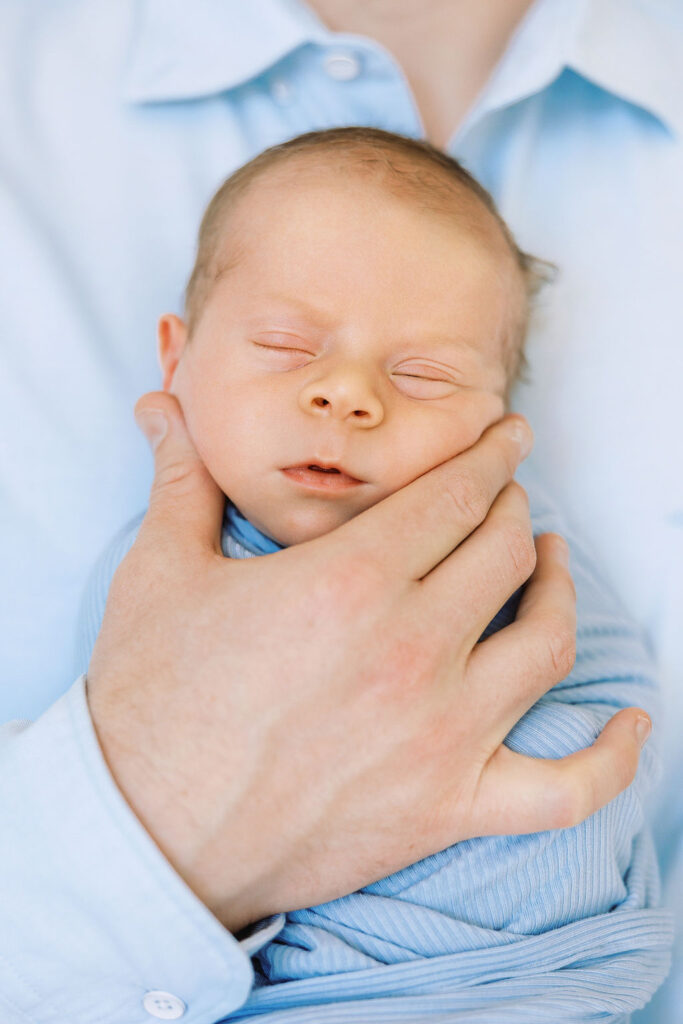 Peaceful sleeping newborn photographed during in-home newborn photography Santa Clarita.