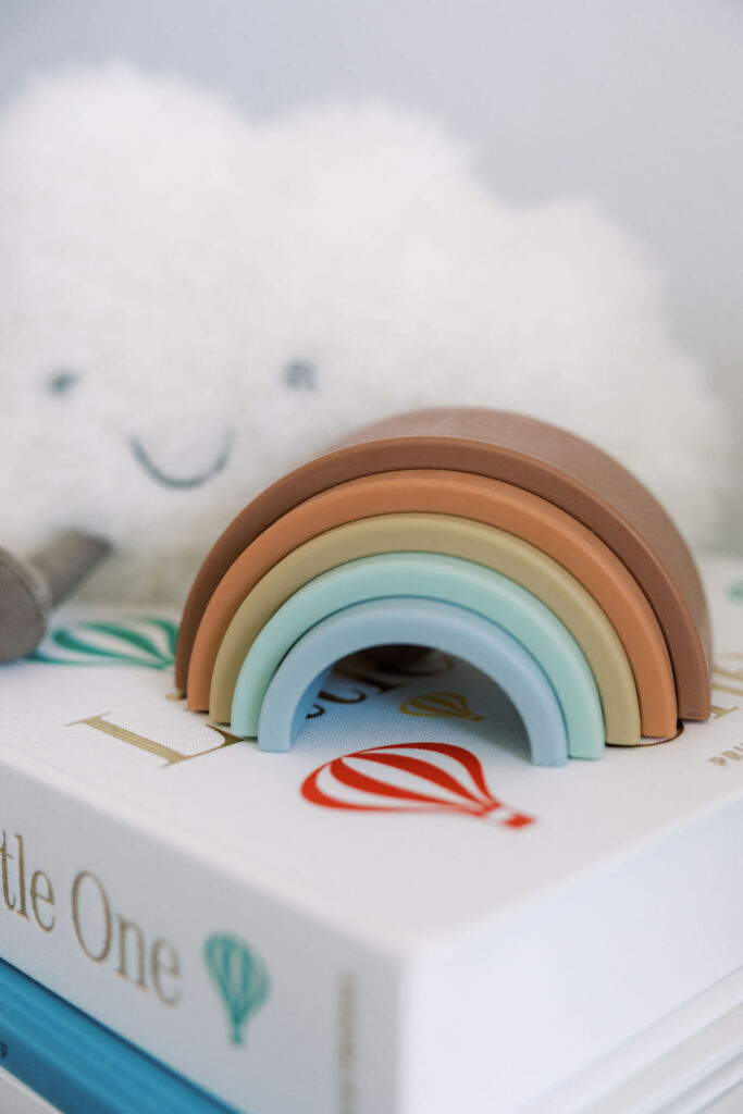 Rainbow nursery toy photographed during an in-home newborn photography Santa Clarita session.