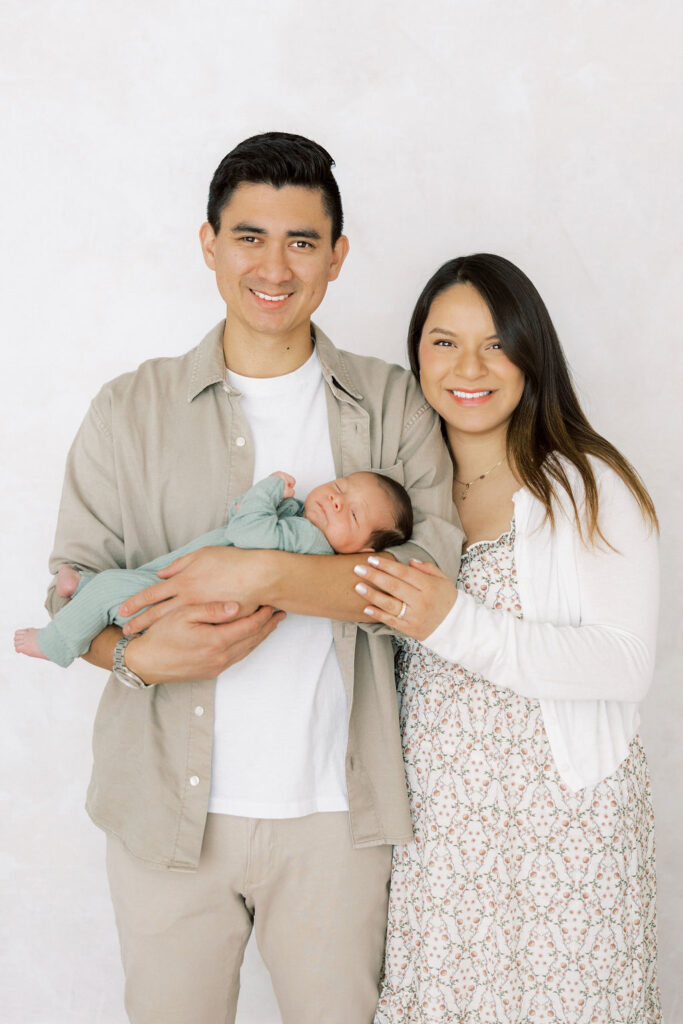 Mom, dad, and newborn together during a lifestyle newborn photography session in Santa Clarita