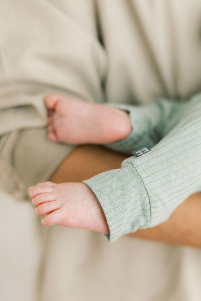 Close up detail of a newborn baby’s feet during a newborn photography session