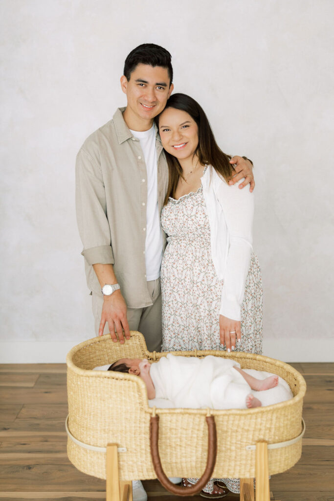 Parents together with their newborn baby during a Santa Clarita newborn photography session