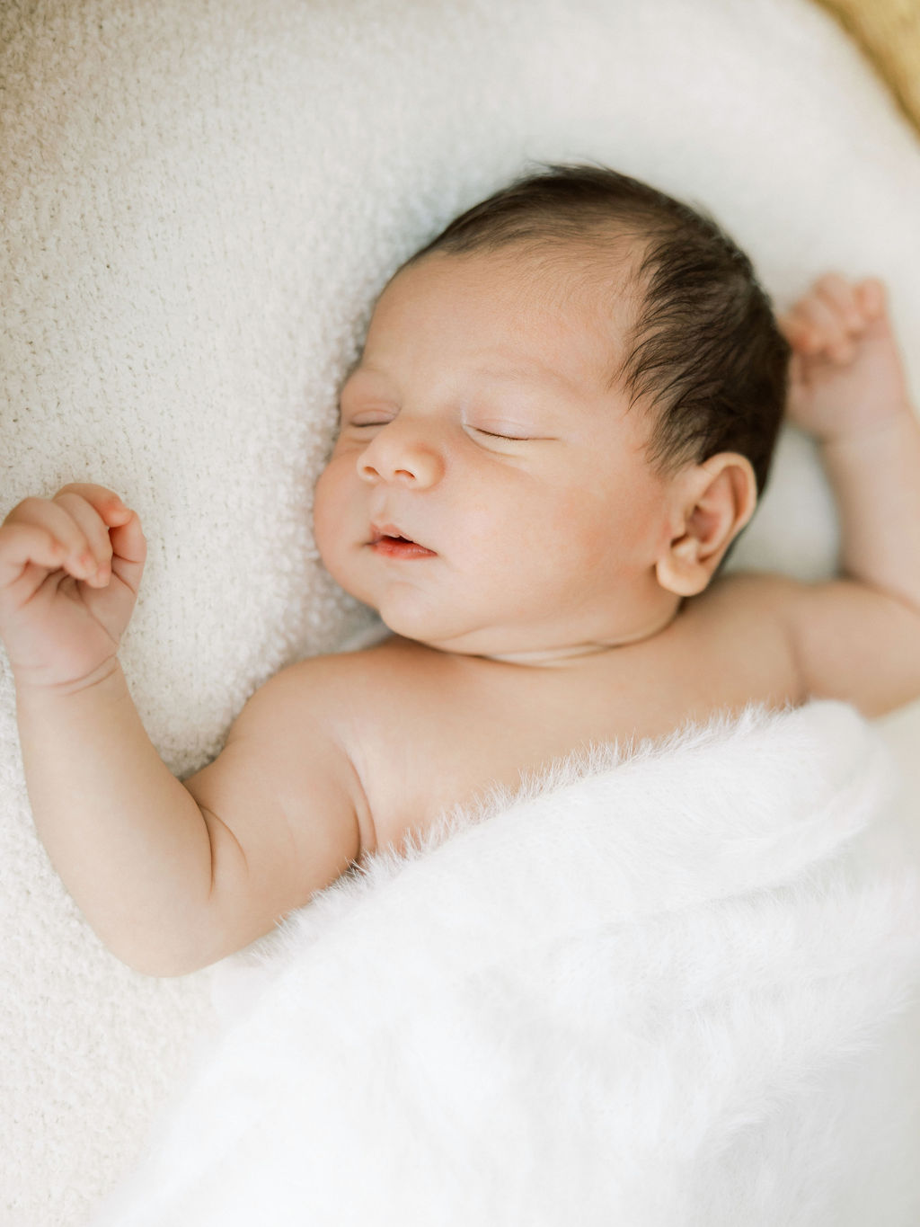 Natural close up portrait of a newborn baby in the studio