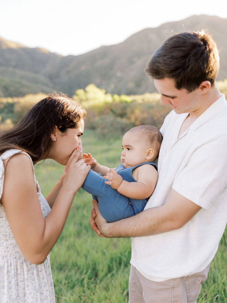 Mom and child enjoying a playful outdoor family photo session in Santa Clarita