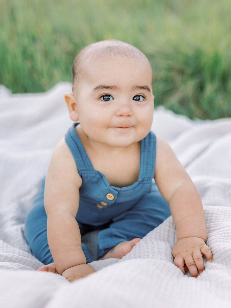 Smiling baby portrait during natural family photos with kids