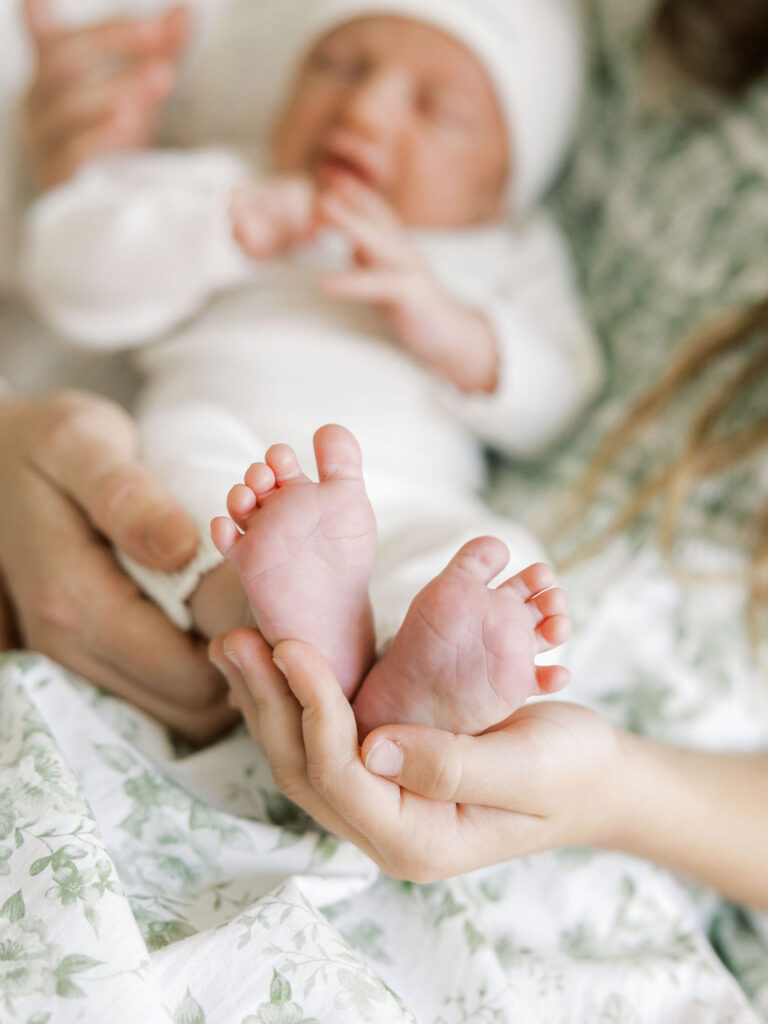 Close up of newborn feet during a lifestyle in home newborn session