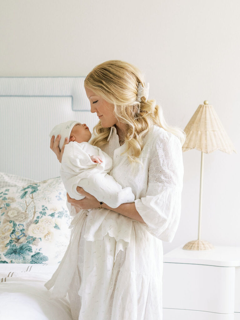 Mother snuggling her newborn baby during a lifestyle newborn photography session