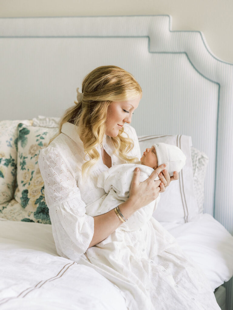 Mom holding her newborn baby during a Santa Clarita newborn photography session