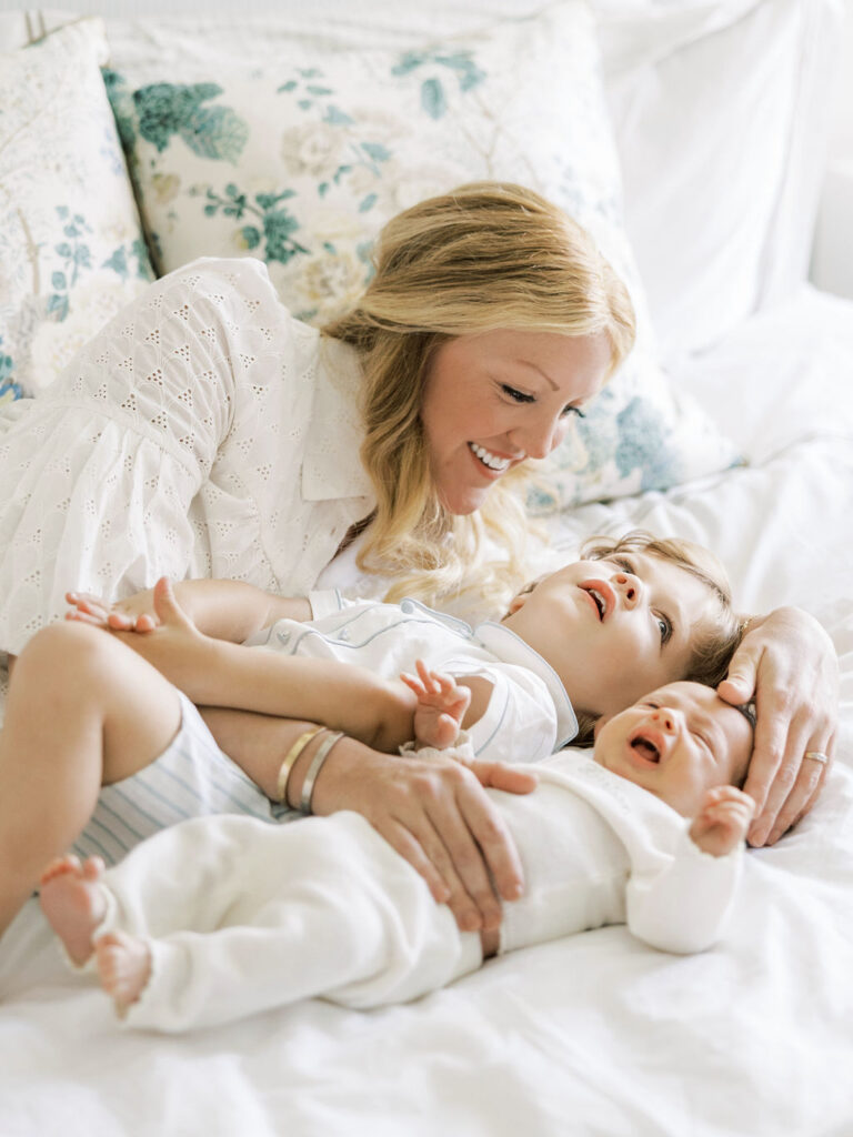 Mom cuddling her newborn baby during a relaxed lifestyle session