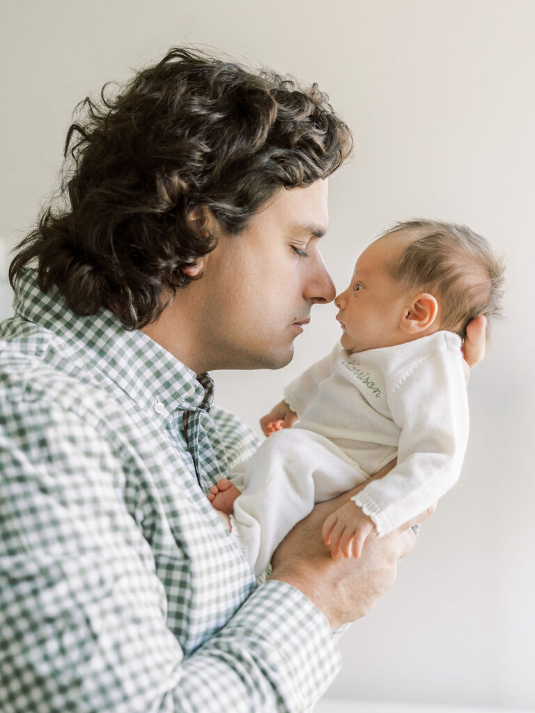 Dad holding his newborn baby during a natural newborn session in Santa Clarita