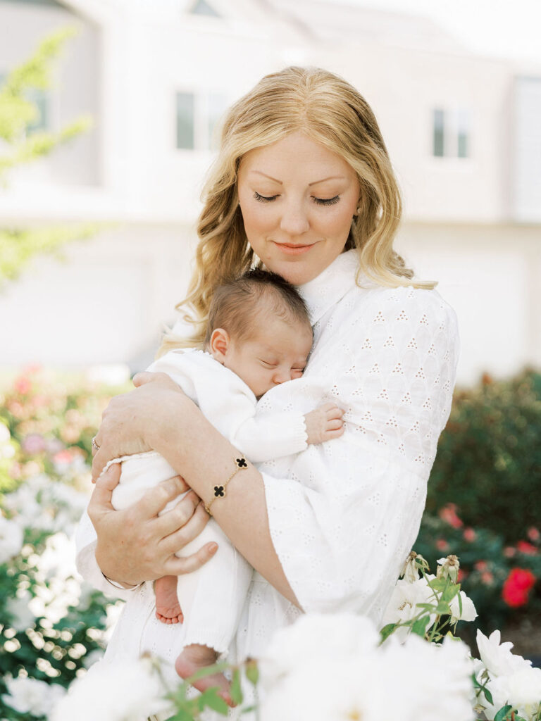 Mom holding her newborn baby during a natural Santa Clarita newborn session
