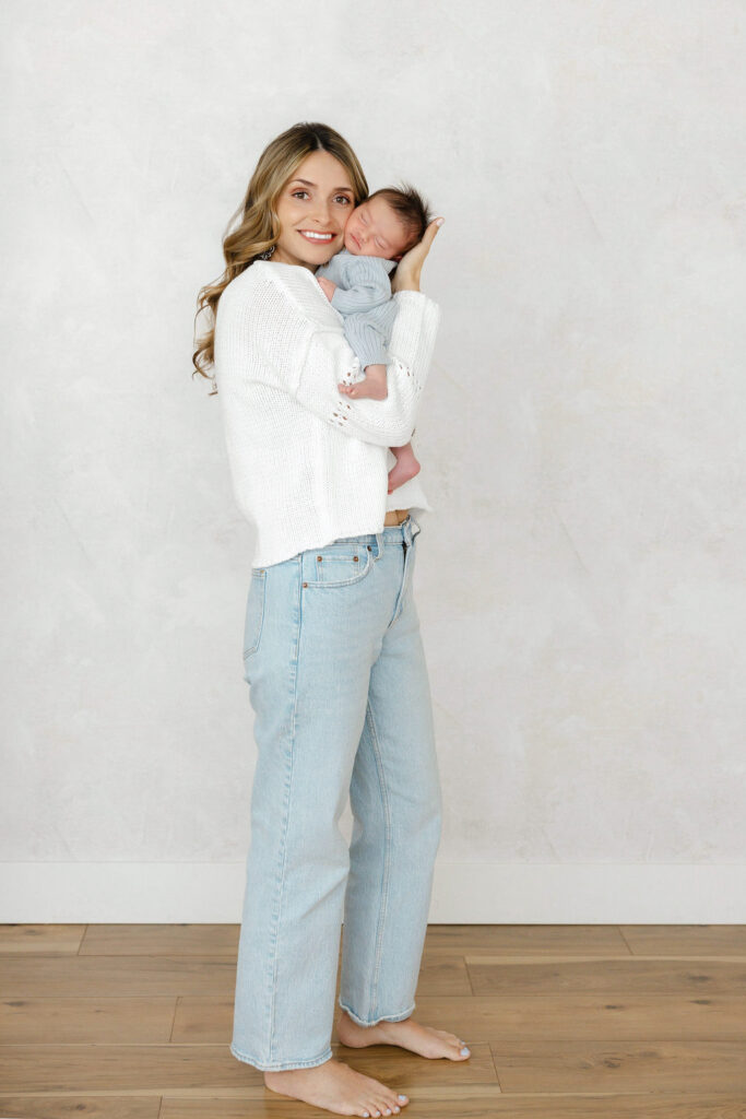 Newborn baby resting peacefully in a parent’s arms