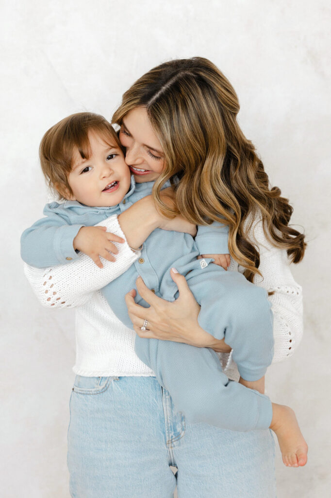 Mom cuddling her child during a relaxed Santa Clarita newborn session