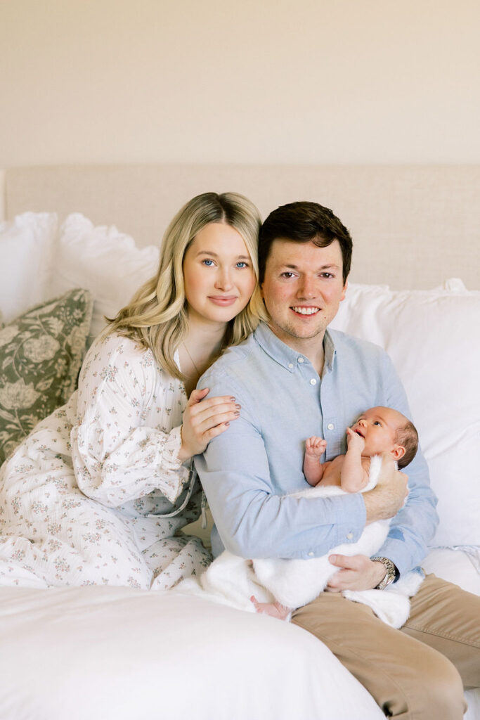 Mom and dad holding their baby during an in home Santa Clarita newborn session