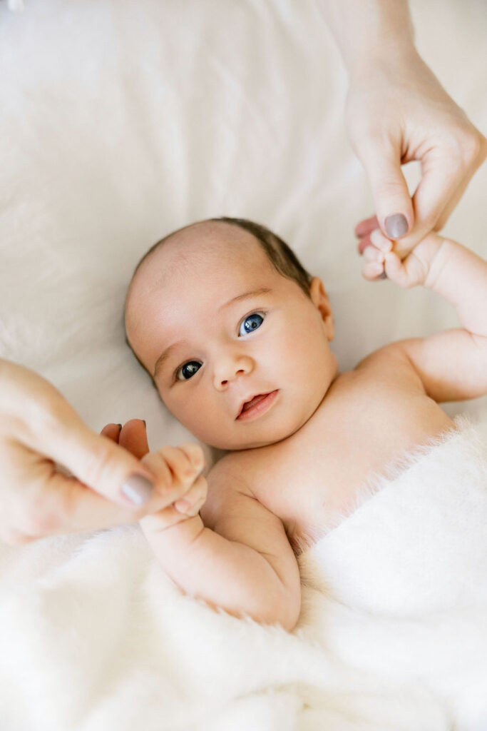 Newborn portrait showing a baby resting comfortably during lifestyle photos