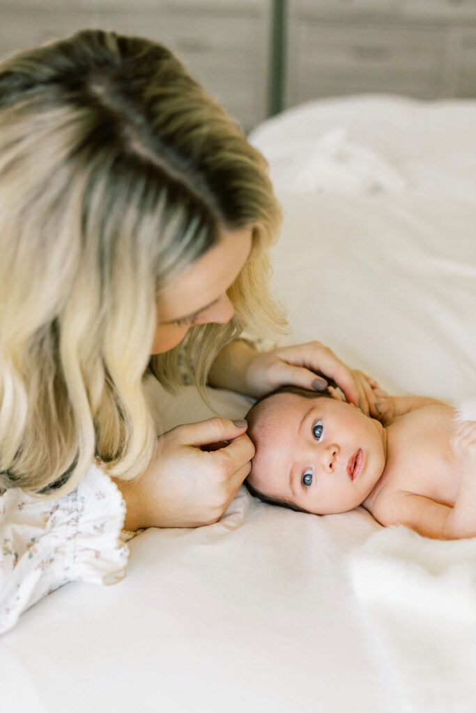 Newborn baby looking up during a natural light newborn photography session