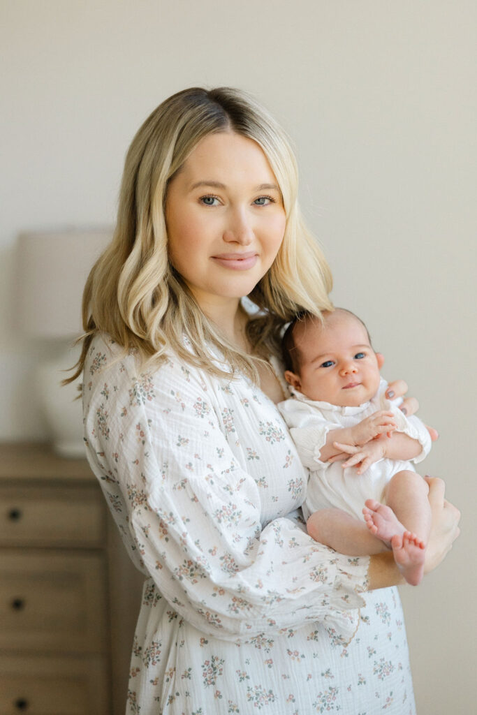 Mom cuddling her newborn baby during a relaxed lifestyle photography session
