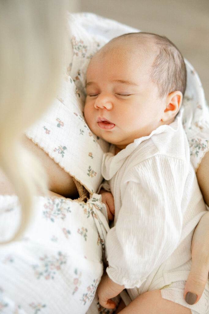Sleeping newborn photographed in natural light during an in home newborn session
